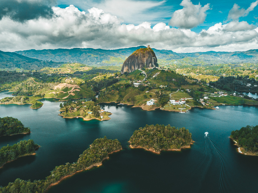 a large body of water surrounded by mountains.