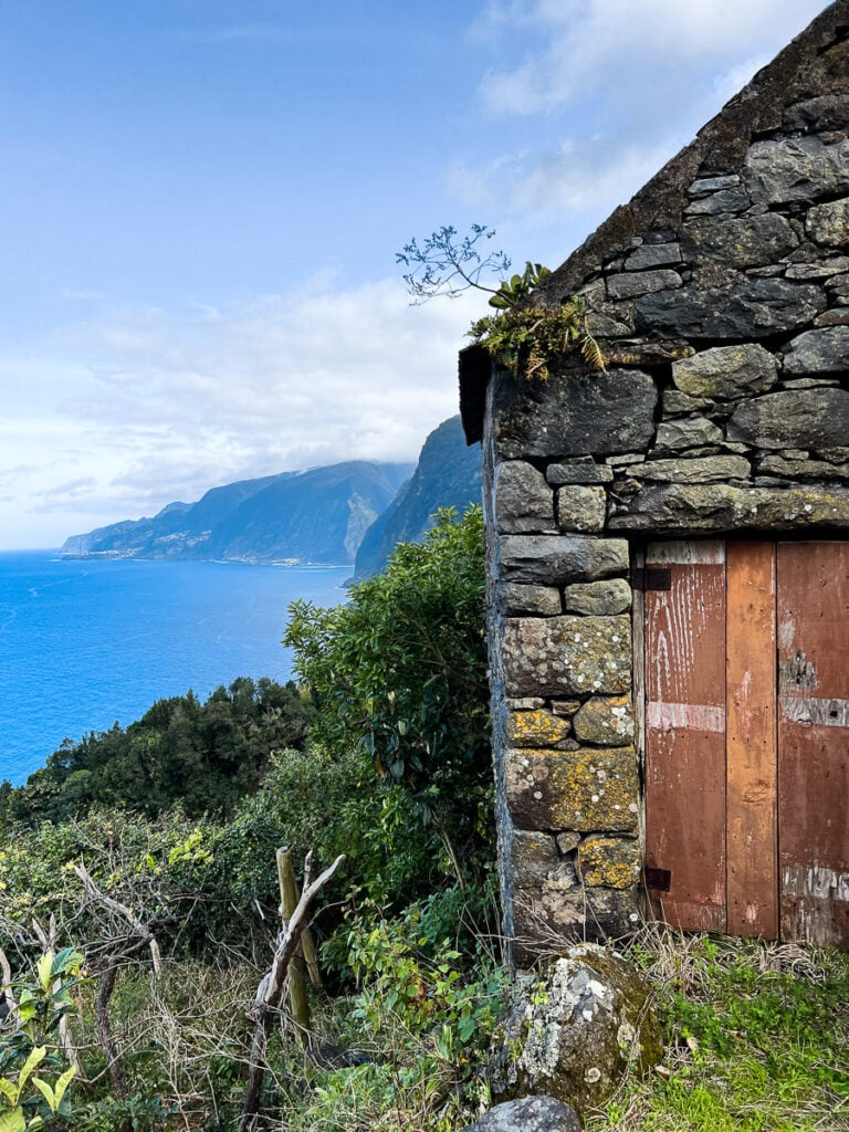 an old stone building with a wooden door.