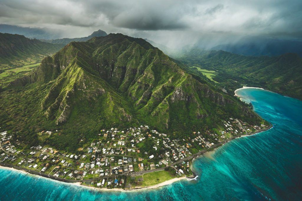 an aerial view of a small island in the middle of the ocean.