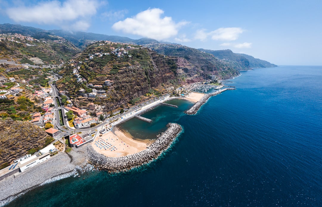 an aerial view of a beach and a body of water.