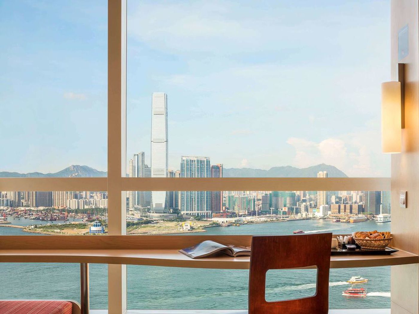 a view of a city from a hotel room.