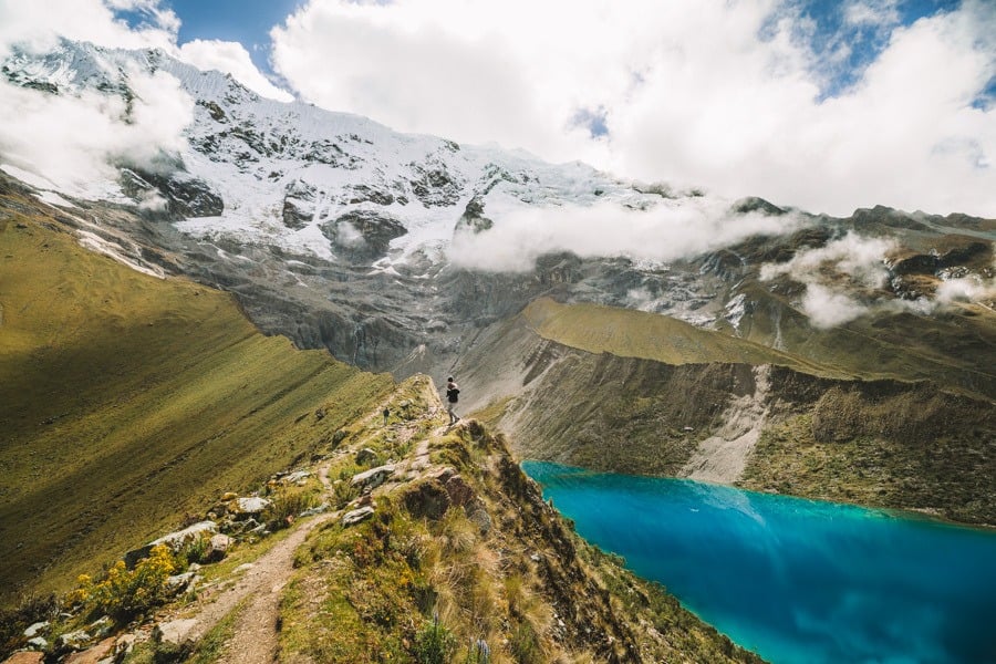 a view of a mountain with a lake in the foreground.