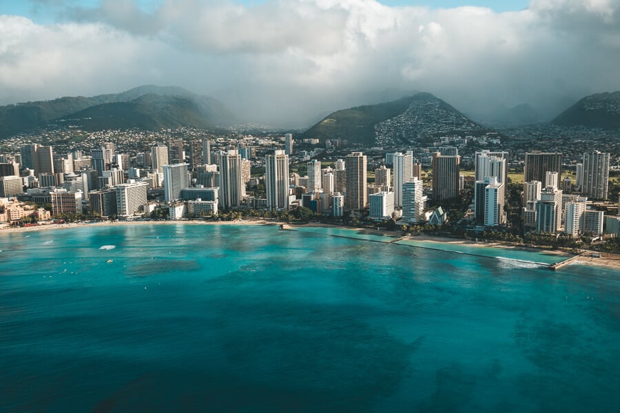 a large body of water with a city in the background.