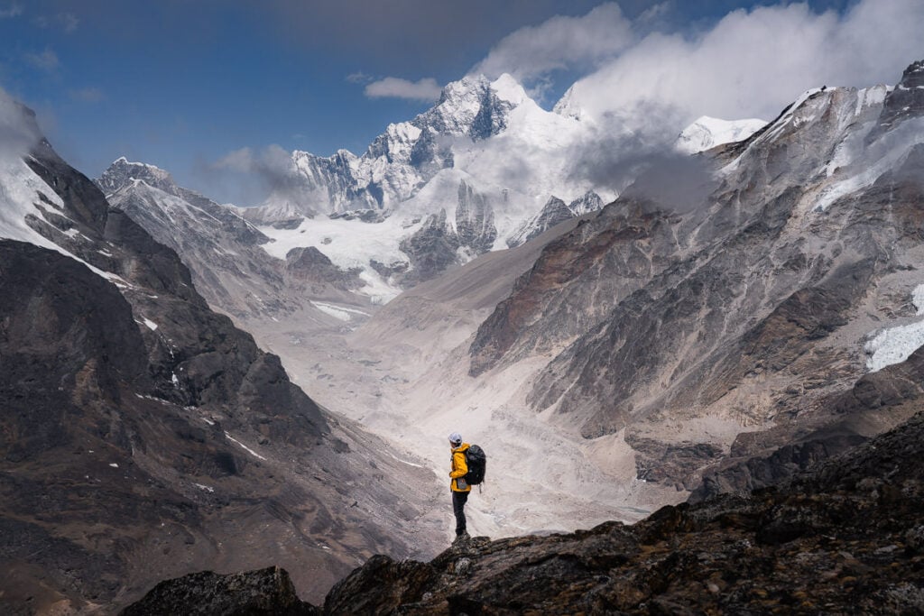 a man standing on top of a rocky mountain