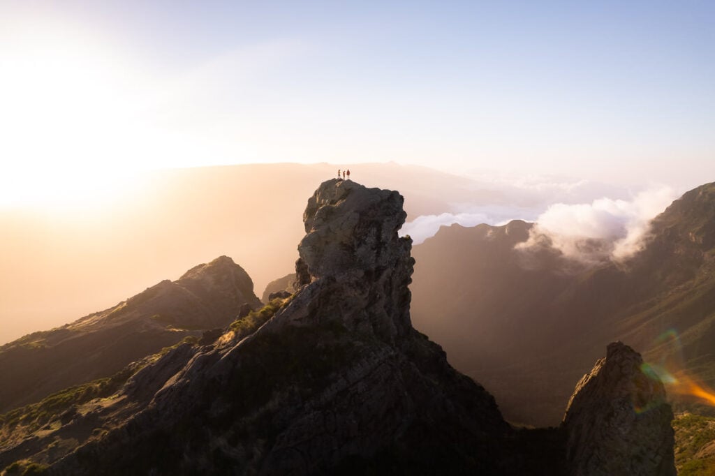 a person standing on top of a mountain