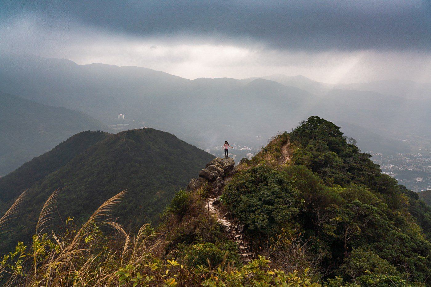 a person standing on top of a mountain.