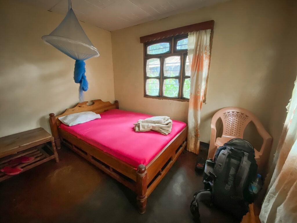 a bedroom with a bed and a chair