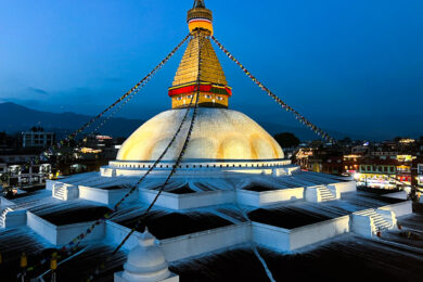 a large white building with a golden dome on top of it